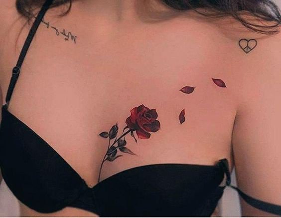Rose chest tattoo female