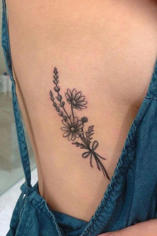 flower rib tattoo idea 7