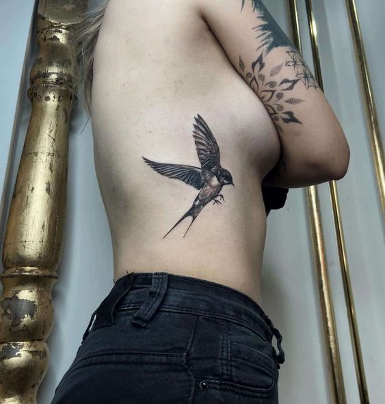 Bird rib cage tattoo